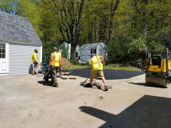 Shattuck Paving crew working on driveway paving and sealcoating